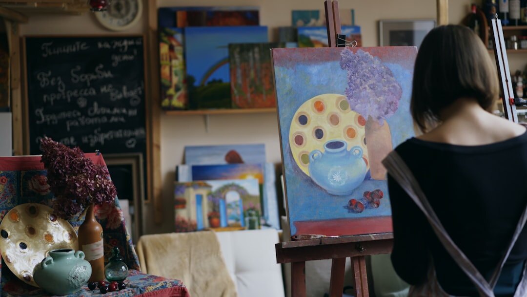 Croatian senior woman painting at a creative art workshop